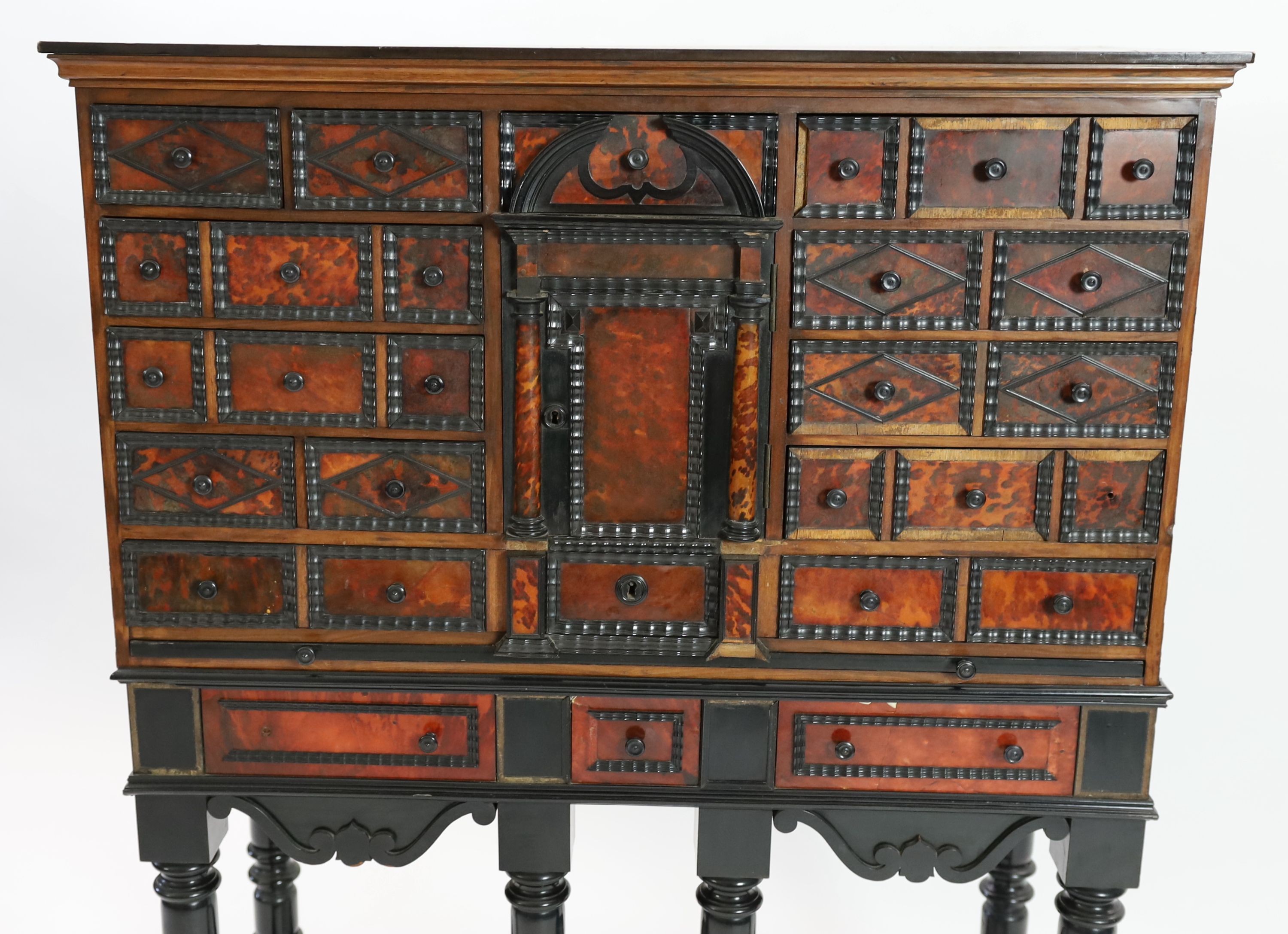 A 17th century Flemish style ebony and tortoiseshell cabinet on stand, width 99cm depth 42cm height 131cm